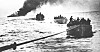 Den norske handelsflåtens innsats under krigen 1940-45. 'Columbus ' er torpedert og står i brann, og mannskapet er i livbåter på vei mot 'Tuscaloosa' som tar dem om bord.